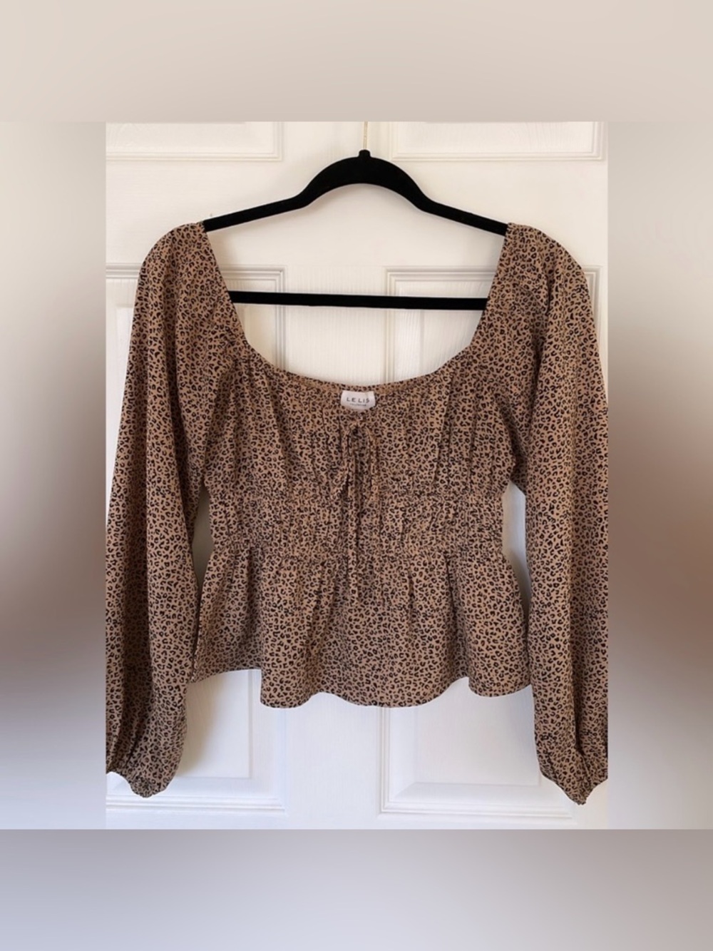 Le Lis | Cheetah Print Smocked Peplum Blouse